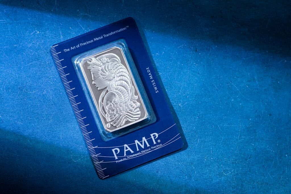 Silver PAMP bar and coin representing precious metals value
