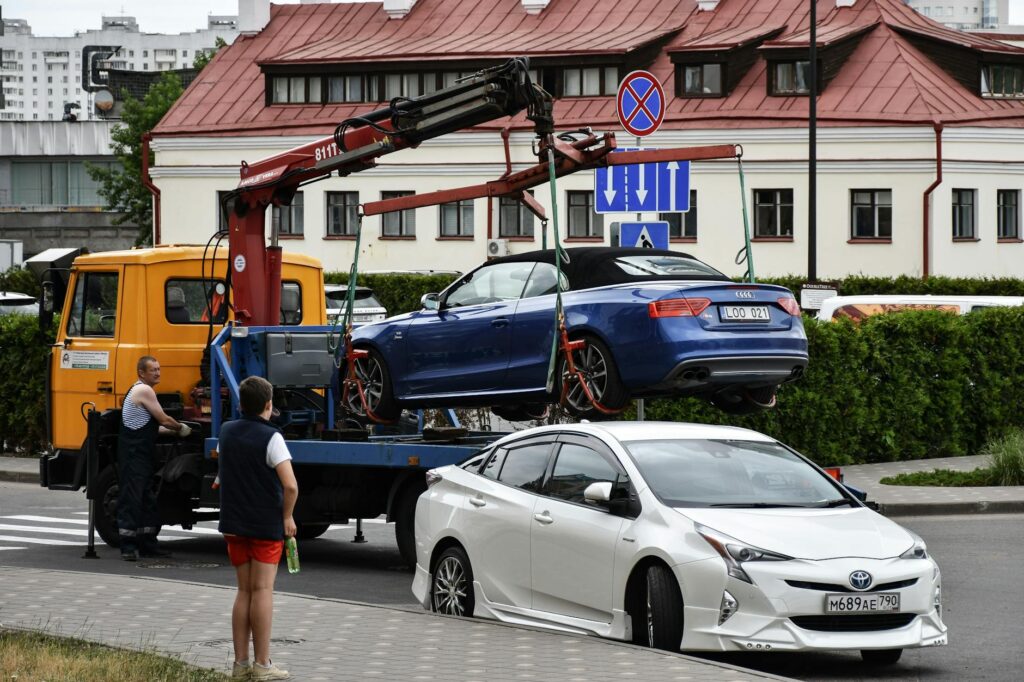 Tow truck carrying a non-running car