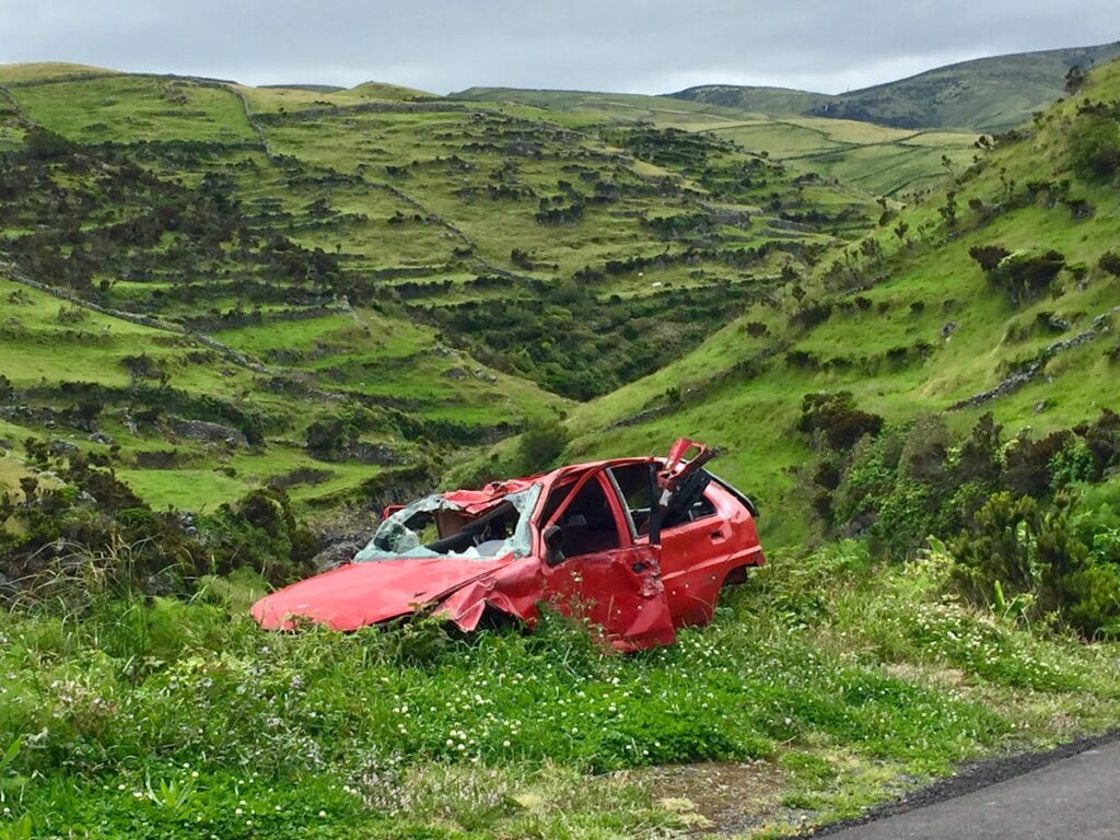 wrecked car in a field