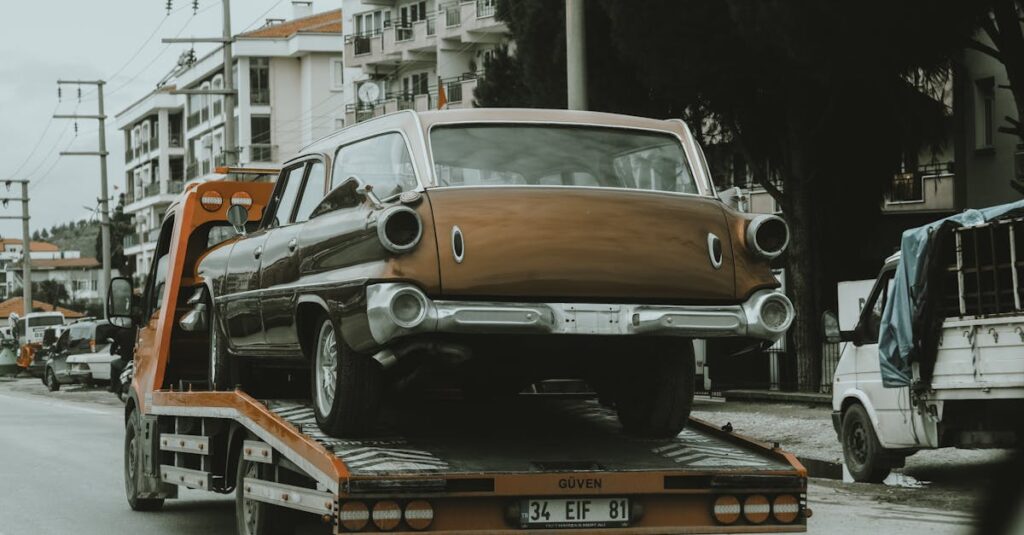 A junk car loaded on a tow truck