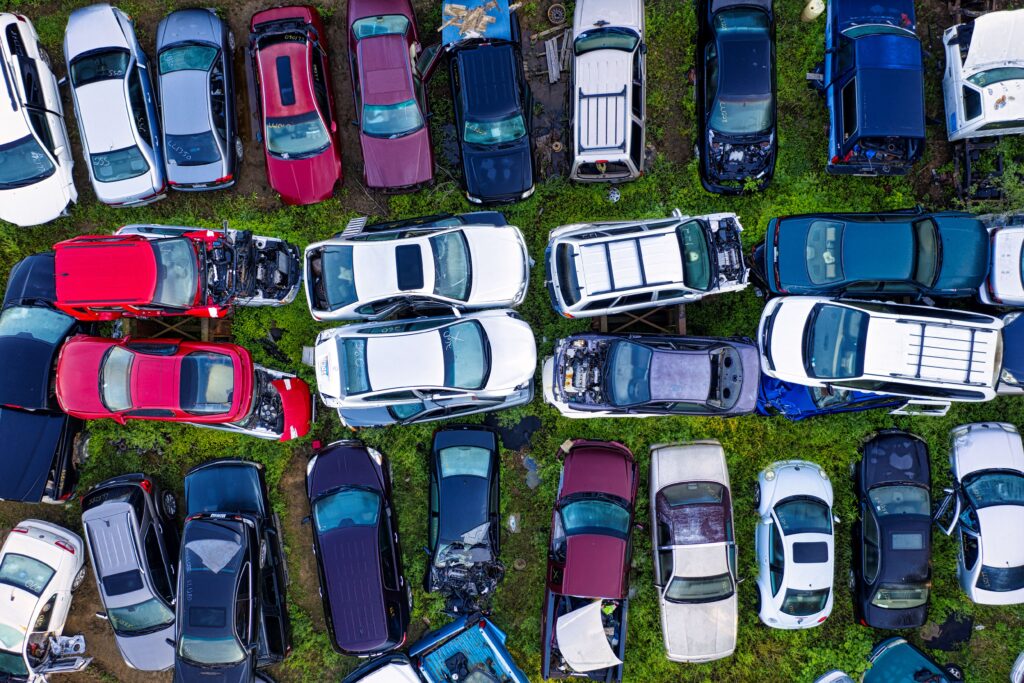 Aerial view of damaged salvage cars in a junkyard