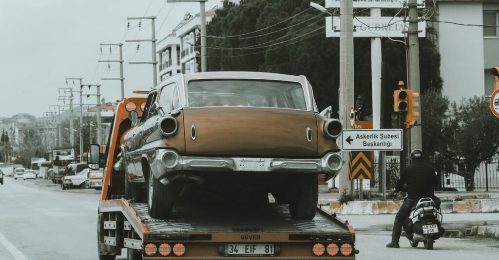 Old car being towed for a cash sale