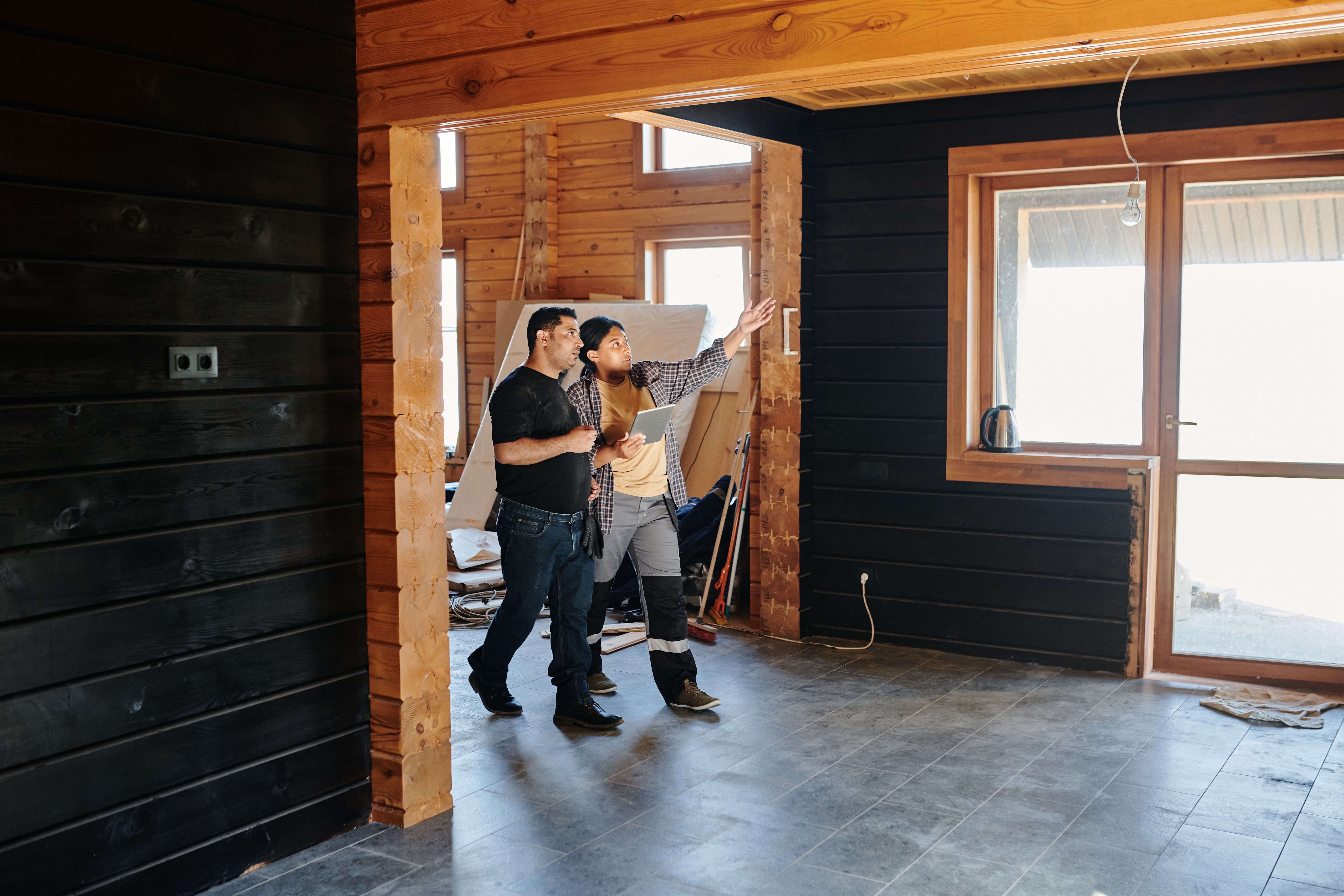 Home renovation discussion in a partially finished room
